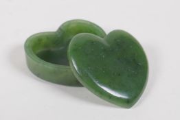 A carved spinach jade heart shaped box and cover, 5 x 5cms