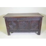 An C18th/C19th carved oak coffer with a plank top, adapted, 132 x 60cm high