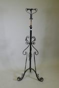 A Victorian wrought iron telescopic floor lamp stand, 138cm high, 200cm extended