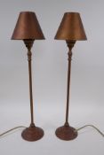 A pair of brass table lamps with shades, 50cm high
