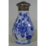 A Delft Pottery sugar sifter with white metal top, marked 830, with export mark and date letter P.