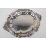 An Elkington Sheffield plate serving tray with shaped rim and foliate border in relief, 46cm long