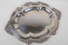 An Elkington Sheffield plate serving tray with shaped rim and foliate border in relief, 46cm long