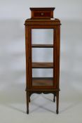 A Victorian inlaid mahogany vitrine/bijouterie cabinet, the shaped top with single drawer, glazed
