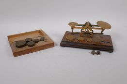 A set of antique brass postage scales by S. Morden & Co, and an accompanying box of brass weights,