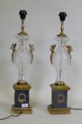 A pair of glass and brass table lamps, with Empire style decoration, 64cm high