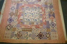 A Victorian/early C20th hand stitched patchwork quilt, 250 x 218cm