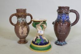 A Victorian majolica centre piece stand in the form of two putti, in the style of Minton, 23cm high,