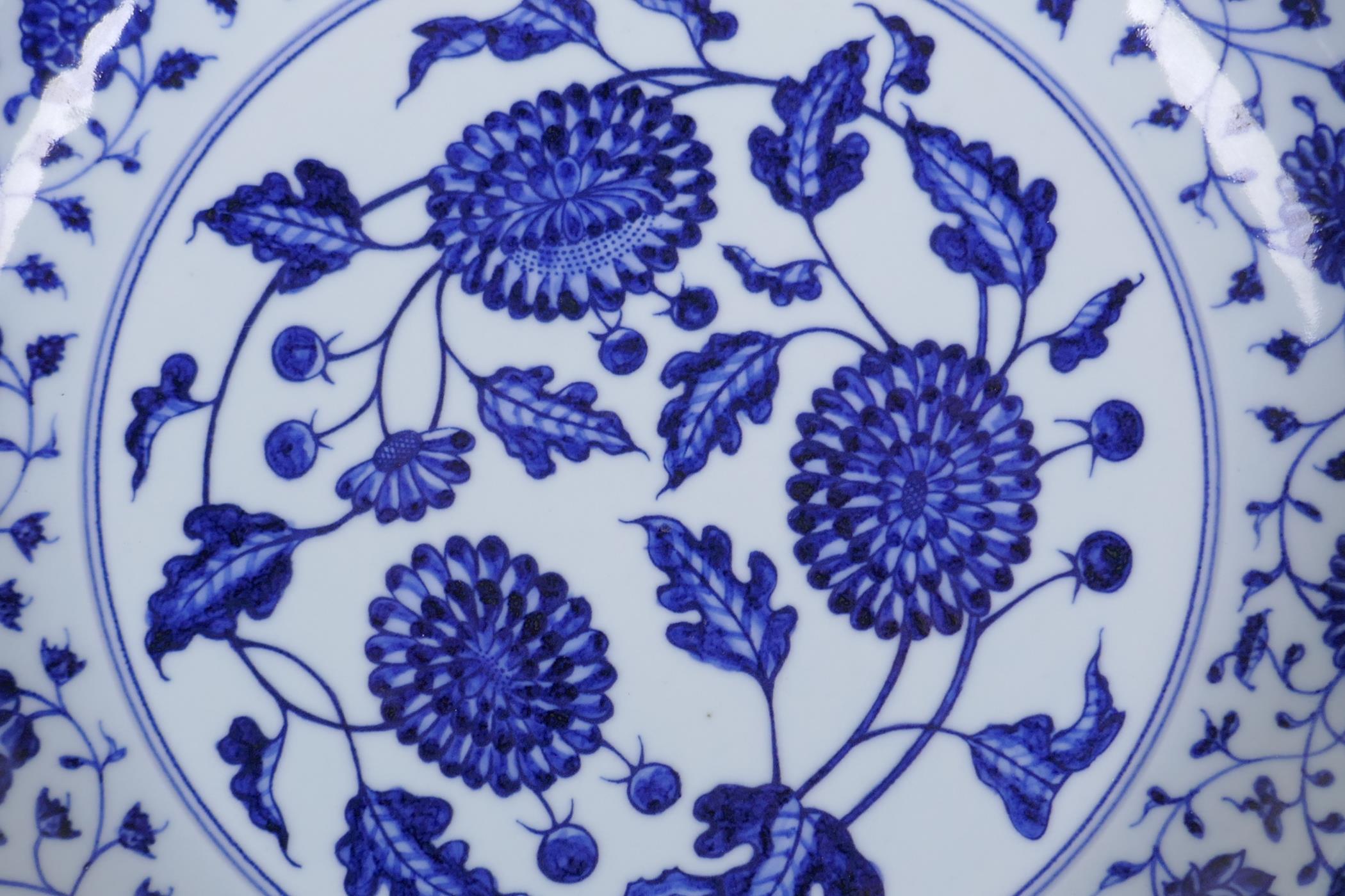 A blue and white porcelain charger decorated with peonies, Chinese Xuande 6 character mark to - Image 2 of 5