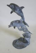 A bronze fountain in the form of two leaping dolphins, 80cm high