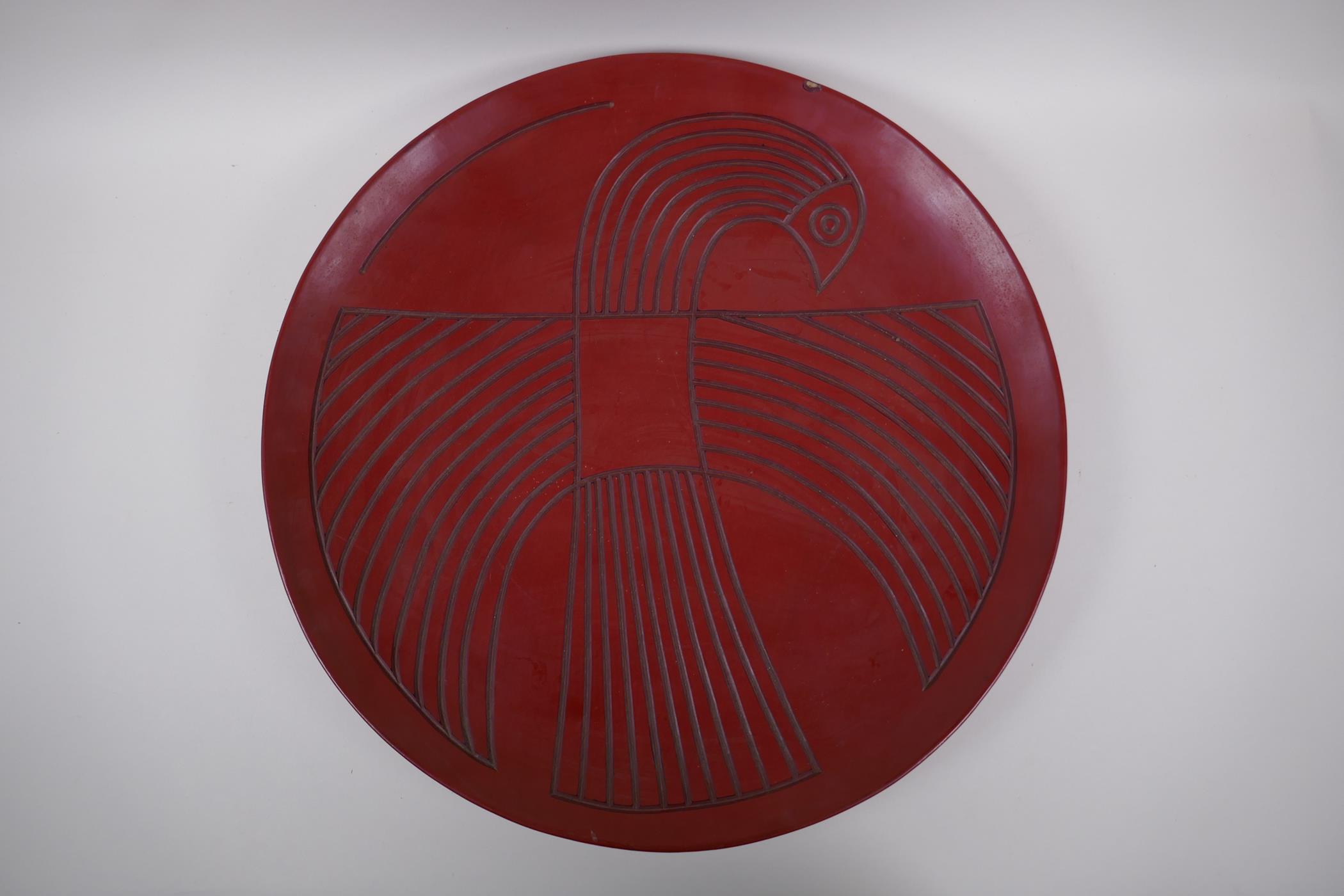 A Chinese red Tixi lacquer charger with stylised bird decoration, Xuande 4 character mark to base, - Image 2 of 8