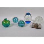 Five glass paperweights including a Caithness 'Blue Octavia', and a swirled art glass scent