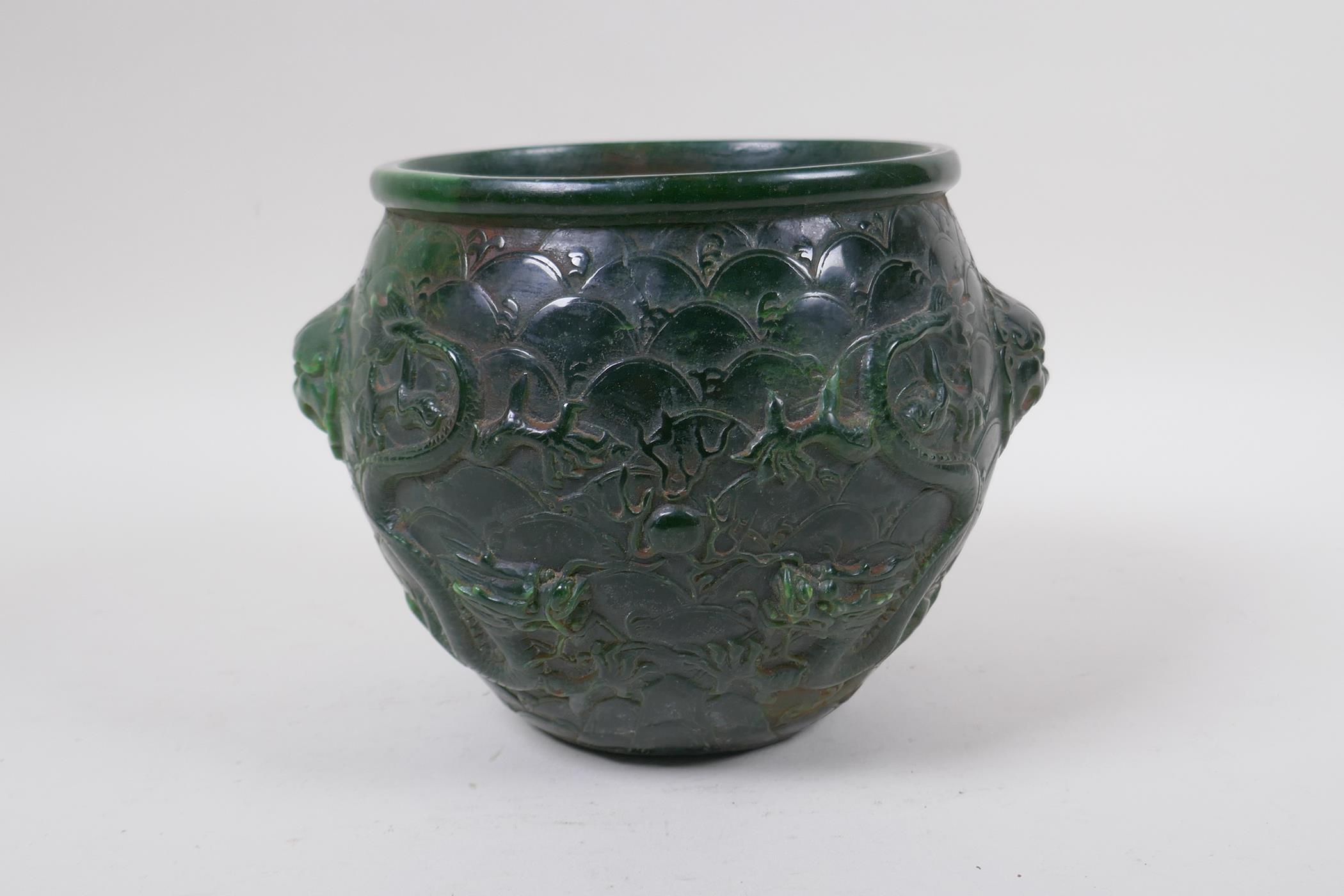 A Chinese reconstituted green hardstone jar with two lion mask handles and raised dragon decoration - Image 3 of 5