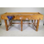 A carpenter's pine workbench fitted with a vice, 184 x 65 x 82cm