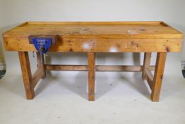 A carpenter's pine workbench fitted with a vice, 184 x 65 x 82cm