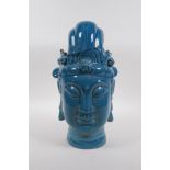 A Chinese teal crackle glazed porcelain head bust of Quan Yin, character inscription to base, 32cm