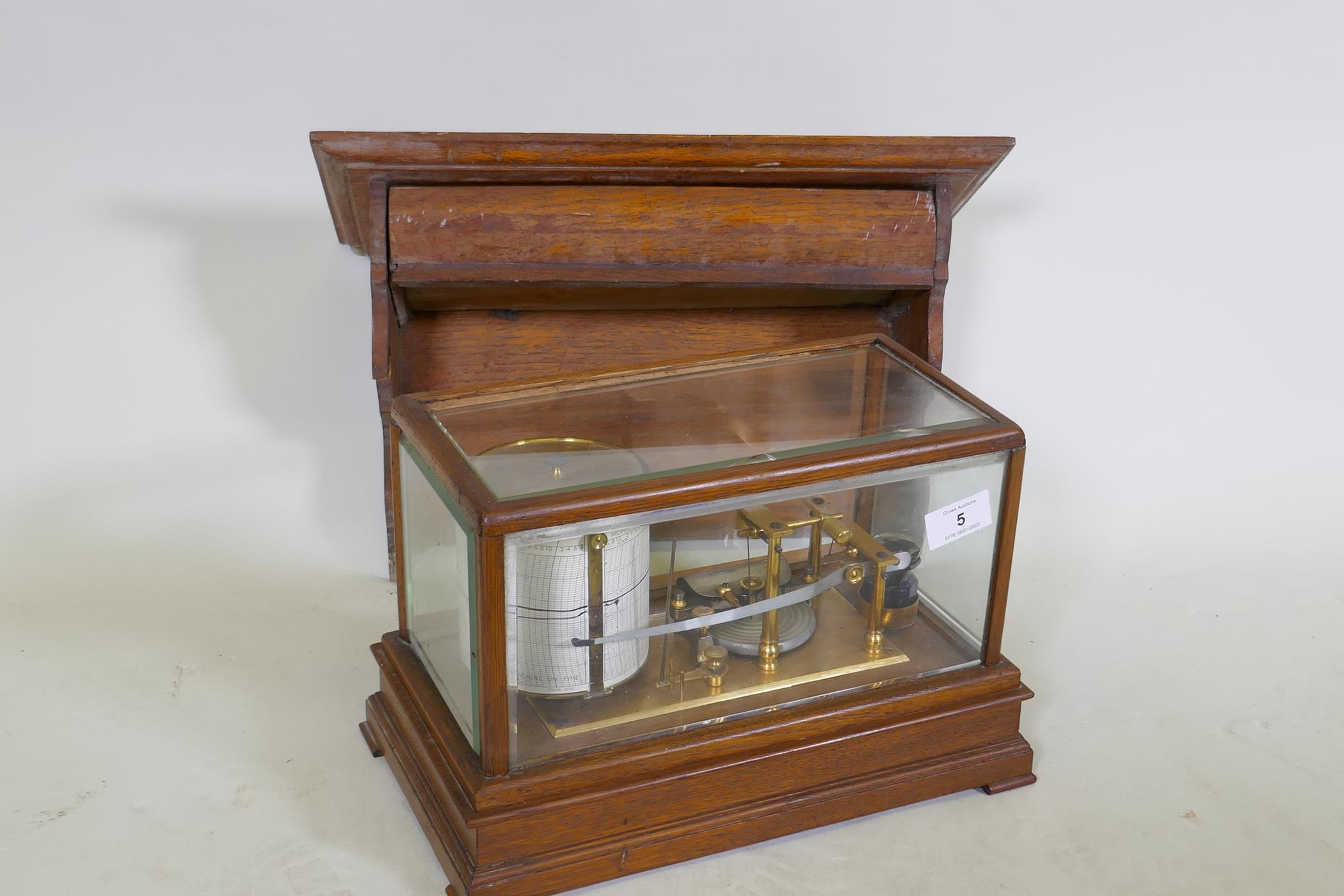 A brass barograph in a glazed oak case with wall bracket fitted with a drawer, glass cracked, drawer - Image 4 of 7