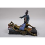 A cold painted bronze figure of a sleeping nude, 19cm long