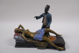 A cold painted bronze figure of a sleeping nude, 19cm long
