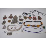 A quantity of Middle Eastern white metal jewellery including stone set pendants, rings, necklaces,
