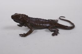A Japanese bronze okimono lizard, mark to base, 13cm long