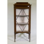 An Edwardian inlaid mahogany single door display cabinet, raised on tapering supports, 62 x 33 x