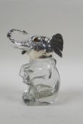 A silver plated and glass ink well in the form of an elephant, 14cm high