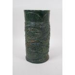 A Chinese reconstituted green hardstone brush pot with dragon and flaming pearl decoration, mark