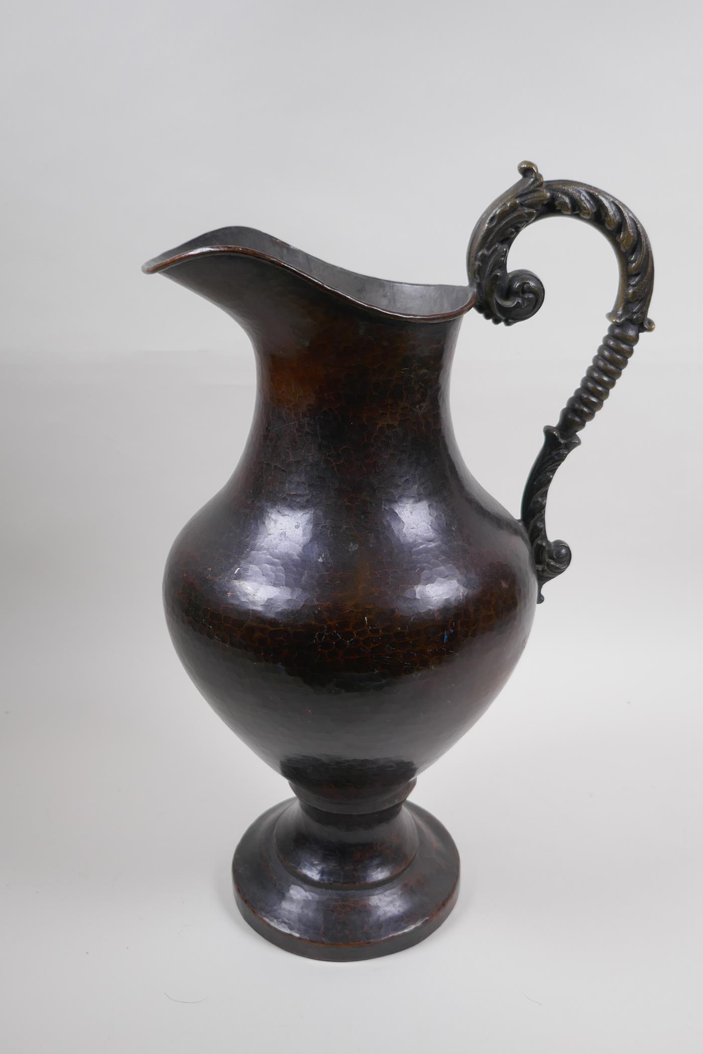 A patinated hammered copper urn with bronze handle, 39cm high - Image 2 of 6