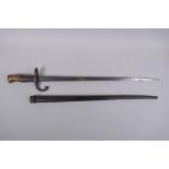 A late C19th French model 1876 bayonet, manufactured in Chatellerault, inscription to the blade, the