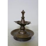 An antique brass stupa/censer, 23cm high