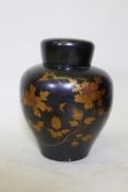 An oriental lacquer storage jar, with internal cover and finely painted gilt decoration, 48cm high