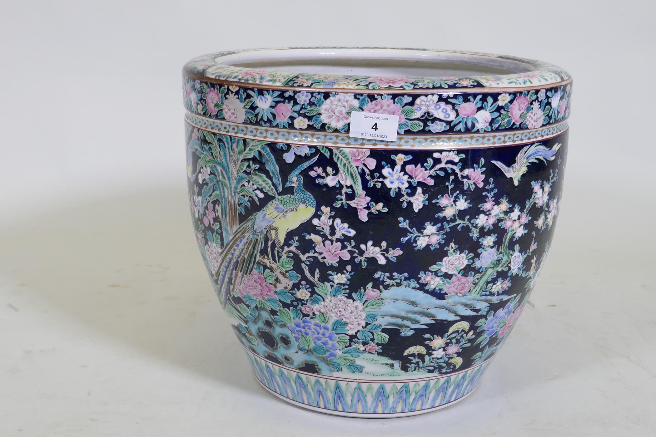 An antique Chinese famille noire ceramic jardiniere, decorated with exotic birds and flowers, 33cm - Image 3 of 7