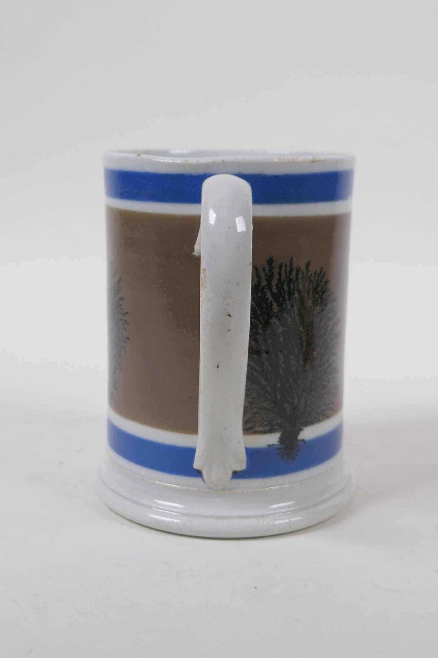 An early Victorian Mocha Ware 'Imperial Pint' tankard with coloured bands and tree designs, 13cm - Image 4 of 5