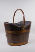 A C19th shaped oak and copper bound coal bucket, 37 x 32cm, 45cm high