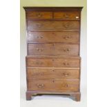 A George III mahogany chest on chest, the upper section with dentil cornice over two + three