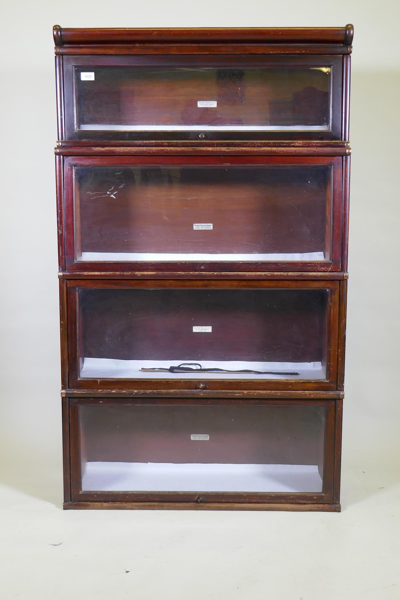 A mahogany Globe Wernicke bookcase of four sections, the upper stepped, lacks base, 87 x 29 x 48cm