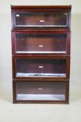 A mahogany Globe Wernicke bookcase of four sections, the upper stepped, lacks base, 87 x 29 x 48cm