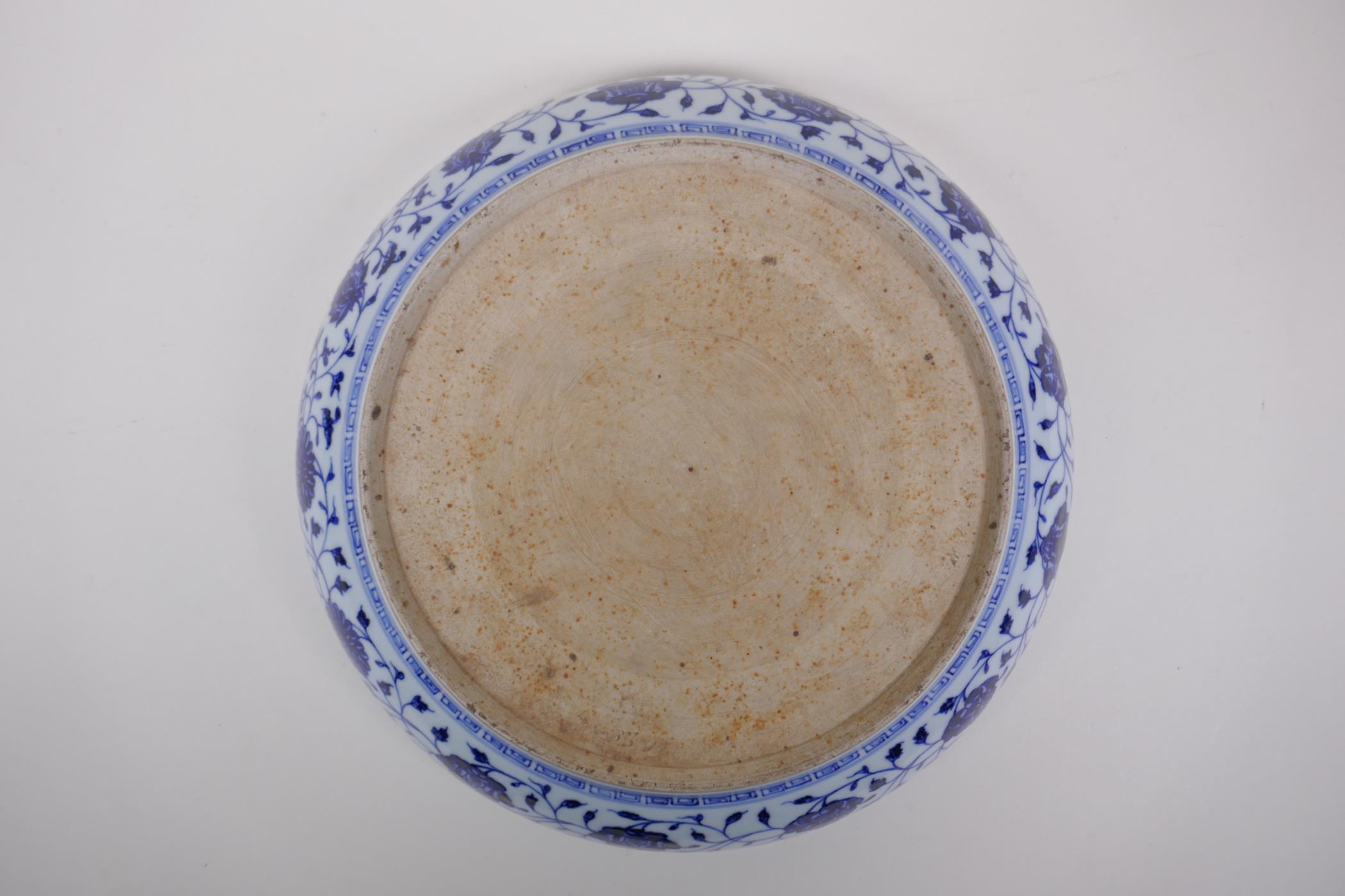 A blue and white porcelain charger decorated with peonies, Chinese Xuande 6 character mark to - Image 5 of 5