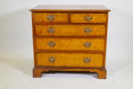 A Brights of Nettlebed burr walnut chest of two over three graduated drawers, with pierced fret