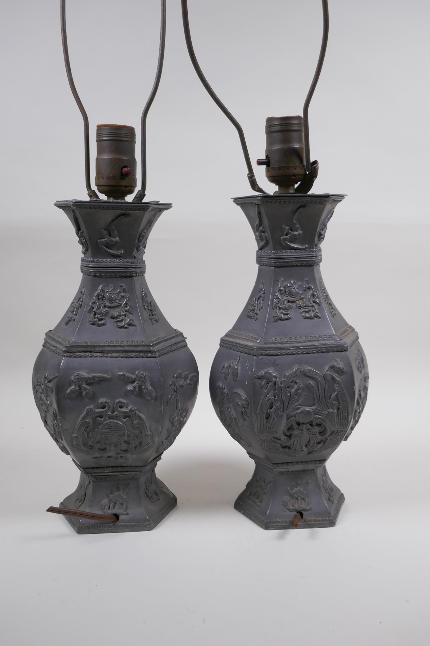 A pair of Chinese pewter lamps decorated with mythical creatures and auspicious symbols, 35cm high - Image 3 of 4