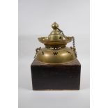 An antique Japanese brass censer housed within an oak box, with an associated cover, 26 x 26cm, 35cm