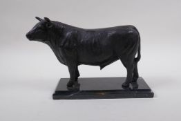 A bronze patinated metal figure of a bull, in the manner of Mene, 26cm long