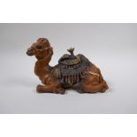 A cold painted bronze inkwell in the form of a camel, 21cm long
