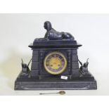 A C19th Egyptian Revival polished slate mantel clock, with patinated bronze mounts, the ormolu