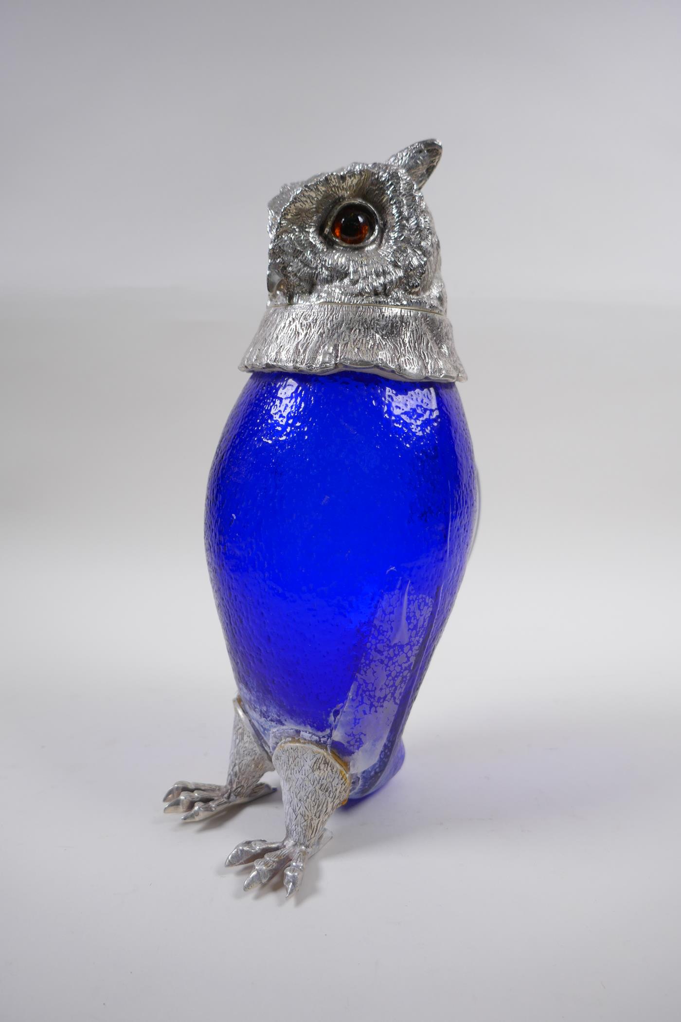 A silver plate and blue glass owl jug, 28cm high