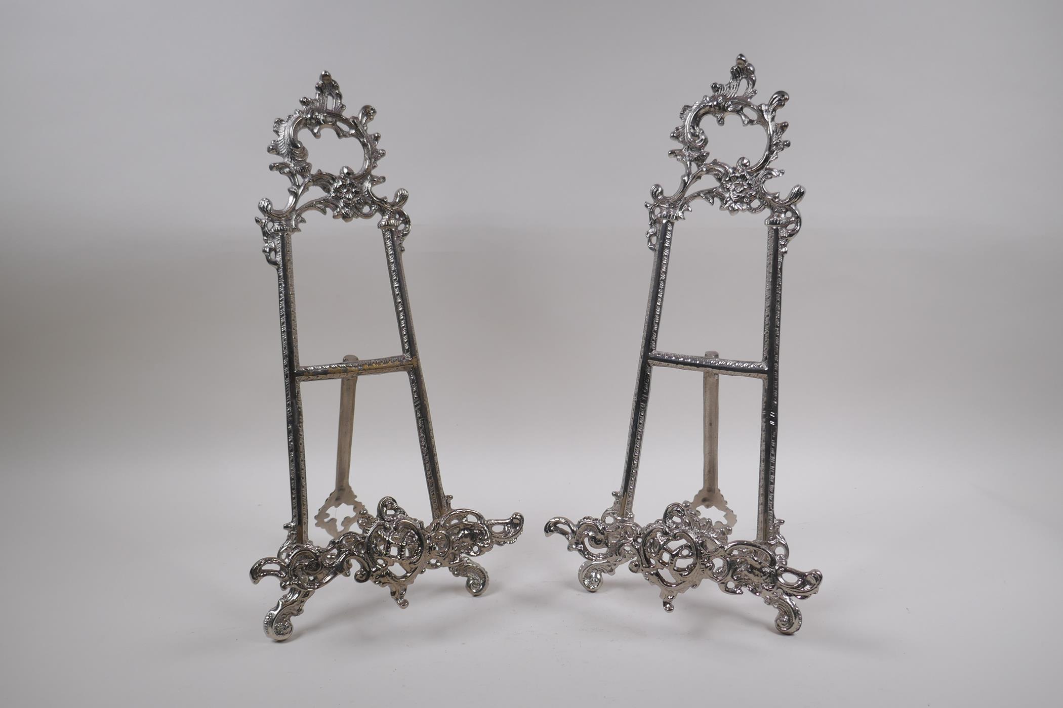 A pair of silver plated easel stands with swag decoration, 41cm high