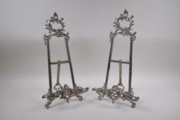 A pair of silver plated easel stands with swag decoration, 41cm high