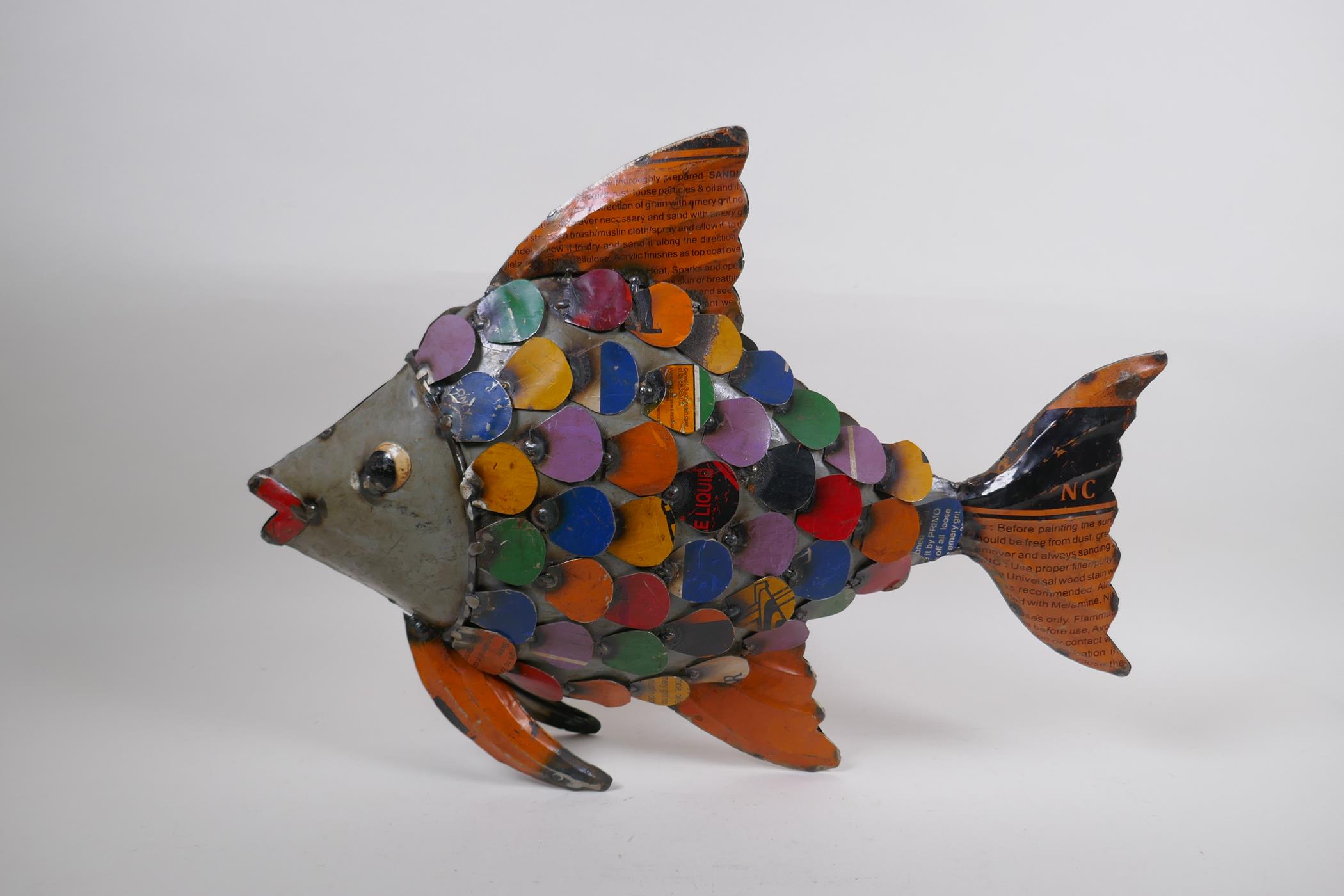 A recycled metal sculpture of a fish, 35cm high