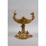 An ormolu centre piece with two handles in the form of putti playing cymbals, 21cm high